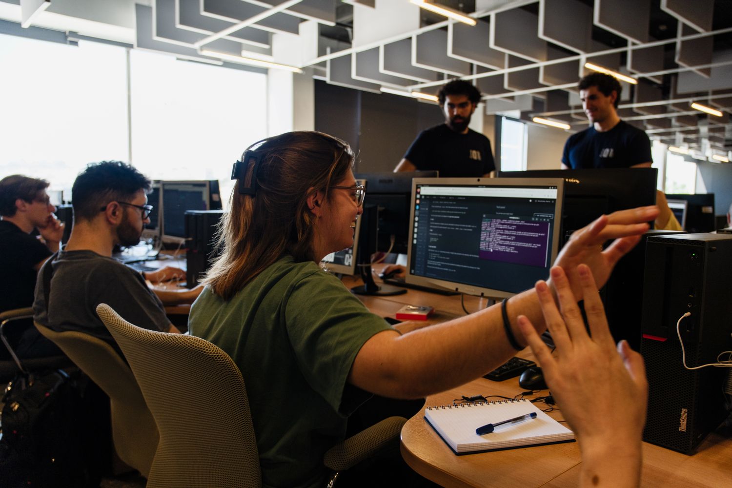 Two people pairing at a screen in an A³ collaboration space