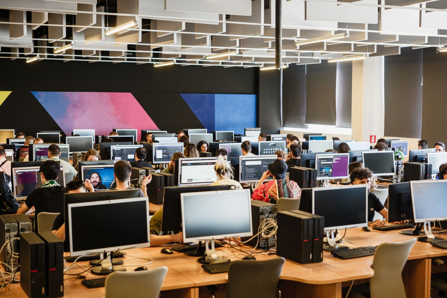 The A³ workshop floor — rows of workstations in use